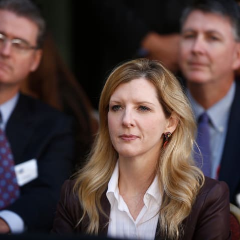 FILE - White House counsel Kathryn Ruemmler listens as President Barack Obama speaks at an installation ceremony for FBI Director James Comey at FBI Headquarters, in Washington, Oct. 28, 2013. (AP Photo/Charles Dharapak, File)