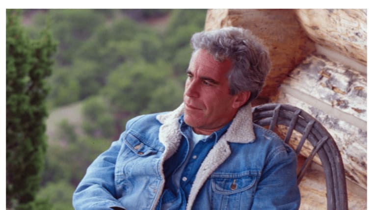 Jeffrey Epstein sits in a wooden porch chair.