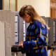 A voter fills out their ballot inside San Francisco City Hall.