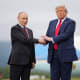 President Donald Trump greets Russian President Vladimir Putin as he arrives at Joint Base Elmendorf-Richardson on Aug. 15, 2025 in Anchorage, Alaska.