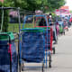 Carts lined up to reserve people’s places in line for meals.