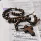 Table top view of a wooden rosary resting on a Bible.