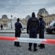 French Police officers seal off the entrance to the Louvre Museum after a Jewllery Heist.