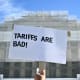 A demonstrator holds up a sign reading "Tariffs are bad" outside the Supreme Court on Nov. 5, 2025.