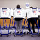 Voters fill out their ballots at a polling station.