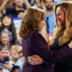Beyonce and Kamala Harris embrace at a campaign rally.