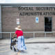 A woman walks to a Social Security office in Houston on July 13, 2022.