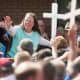 Rowan County Clerk of Courts Kim Davis waves to a crowd of her supporters at a rally in front of the Carter County Detention Center on Sept. 8, 2015 in Grayson, Ky.