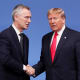 Jens Stoltenberg and Donald Trump shake hands