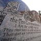 A granite Ten Commandments monument stands on the ground of the Texas Capitol