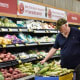 A man shops at supermarket.