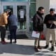 People arrive for appointments at U.S. Immigration and Customs Enforcement (ICE) in Chantilly, Virginia.
