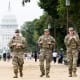 Members of the National Guard patrol near the Capitol