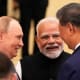 Indian Prime Minister Narendra Modi, center, talks with Russian President Vladimir Putin, left, and Chinese President Xi jinping