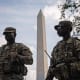Members of the D.C. National Guard stand in front of the Washington Monument on Aug.17, 2025.