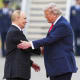 President Donald Trump greets Russia's President Vladimir Putin