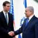 Benjamin Netanyahu, right, shakes hands with advisor Jared Kushner