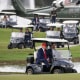 Eric Trump drives President Trump in golf cart