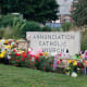 Image: People visit a makeshift memorial at Annunciation Catholic Church after the Wednesday's shooting at the school, Friday, Aug. 29, 2025, in Minneapolis.