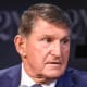 Joe Manchin speaks while seated on stage