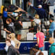 Travelers at a security checkpoint at