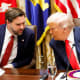U.S. President Donald Trump speaks with U.S. Vice President JD Vance.