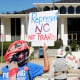 Demonstrators approach the Legislative Building during a rally protesting a proposed election redistricting map on Tuesday.