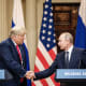President Donald Trump and Russian President Vladimir Putin shae hands