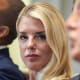 Pam Bondi, left, listens as President Donald Trump speaks