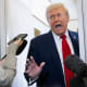 President Donald Trump speaks with the media aboard Air Force One.