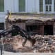 An excavator works to clear rubble after the East Wing of the White House was demolished.