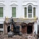 An excavator sits on the rubble after the East Wing of the White House was demolished.