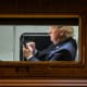 US President Donald Trump uses a cellphone aboard Marine One.