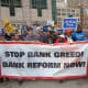 Unions, religious groups and community organizations in Chicago rally outside the conference of the American Bankers Association.