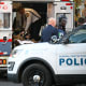 An unidentified man in military fatigues lies on a stretcher inside an ambulance in downtown Washington, D.C.