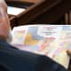 A State Representative reviews a map of proposed Texas congressional redistricting.