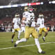 Aneyas Williams of the Notre Dame Fighting Irish runs the ball for a touchdown against the Stanford Cardinal.