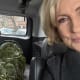 Mika Brzezinski in her car with the Christmas Tree she bought.