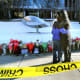 People hug in front of a memorial at Brown University.