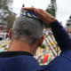 A man touches his kippah during a menorah lighting ceremony at a floral memorial for victims of the Bondi Beach shooting on Dec. 16, 2025 in Sydney, Australia.