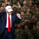 President Donald Trump dances in front of troops.
