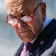 Senate Minority Leader Chuck Schumer attends a news conference outside the Capitol.