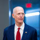 Sen. Rick Scott arrives for a vote at the Capitol.