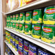Canned food and other products in an aisle at a grocery store in NY