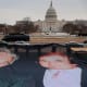A photo of President Donald Trump and convicted sex offender Jeffrey Epstein is unfurled on the National Mall near the U.S. Capitol.