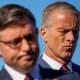 Speaker of the House Mike Johnson and Senate Majority Leader John Thune both looking down and disappointed at a news conference.