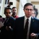 Speaker of the House Mike Johnson, R-La., talks with reporters in the U.S. Capitol during the last votes of the year.