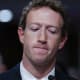 Meta CEO Mark Zuckerberg looks down as he testifies before the Senate Judiciary Committee.