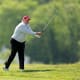 Donald Trump playing golf.