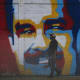 A man walks past a graffiti depicting Venezuelan President Nicolas Maduro in Caracas on January 3, 2026.